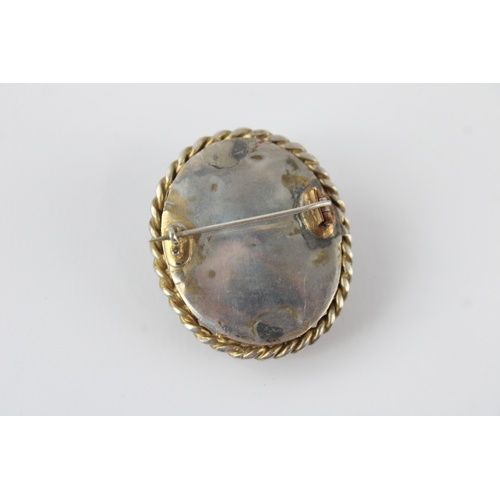 107 - Silver mounted lava cameo brooch (15g)