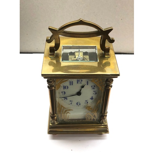 387 - Antique brass carriage clock original box and key clock winds and ticks,  clock height approximately... 