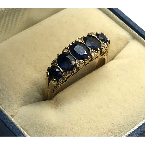 151 - 18ct gold diamond and sapphire ring, largest central sapphire measures 5mm x 3mm