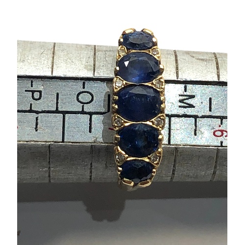 151 - 18ct gold diamond and sapphire ring, largest central sapphire measures 5mm x 3mm