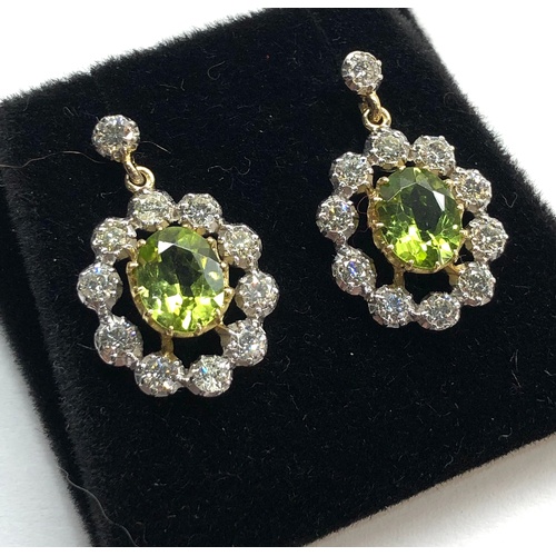 158 - Fine diamond and peridot earrings peridot measures approx 8.5mm by 7mm with diamonds around drop 23m... 