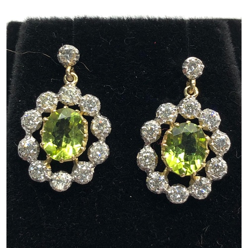 158 - Fine diamond and peridot earrings peridot measures approx 8.5mm by 7mm with diamonds around drop 23m... 