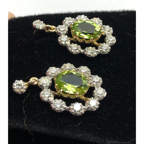 158 - Fine diamond and peridot earrings peridot measures approx 8.5mm by 7mm with diamonds around drop 23m... 