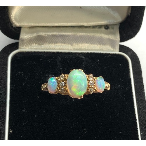 159 - Antique 18ct diamond and opal ring central opal measures approx 8.5mm by 6mm marked 1922 and 18ct