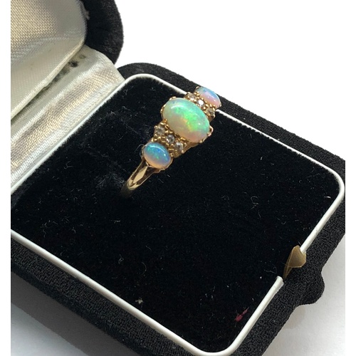 159 - Antique 18ct diamond and opal ring central opal measures approx 8.5mm by 6mm marked 1922 and 18ct