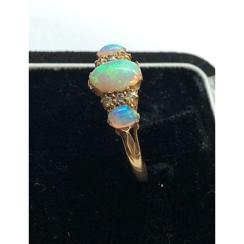 159 - Antique 18ct diamond and opal ring central opal measures approx 8.5mm by 6mm marked 1922 and 18ct