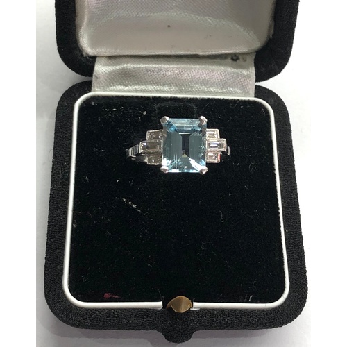 166 - Aquamarine and diamond ring set with large central aquamarine that measures approx 9.5mm by 7.5mm wi... 