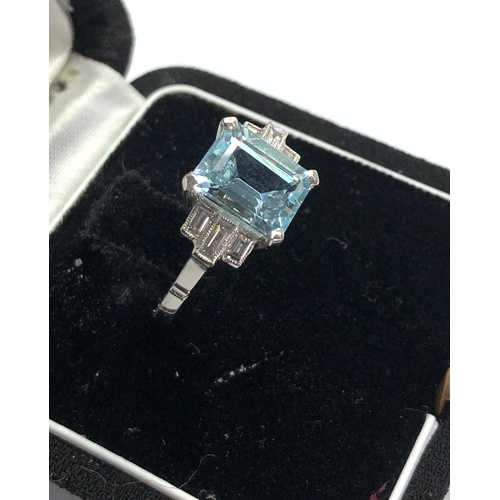 166 - Aquamarine and diamond ring set with large central aquamarine that measures approx 9.5mm by 7.5mm wi... 