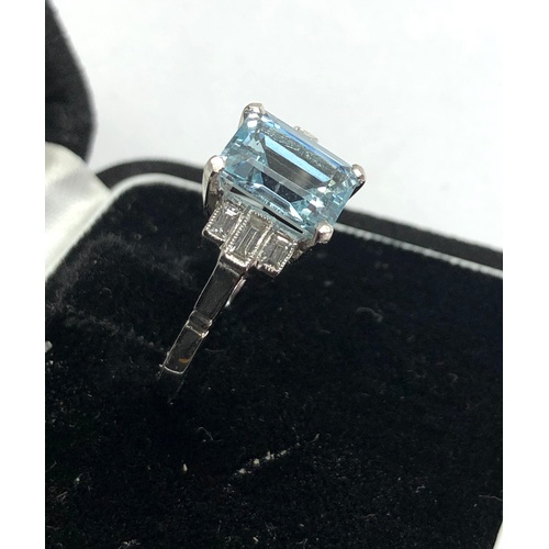 166 - Aquamarine and diamond ring set with large central aquamarine that measures approx 9.5mm by 7.5mm wi... 