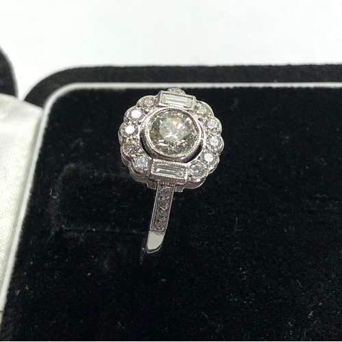 174 - Platinum and diamond cluster ring central diamond measures approx 5.5mm dia set with diamonds around