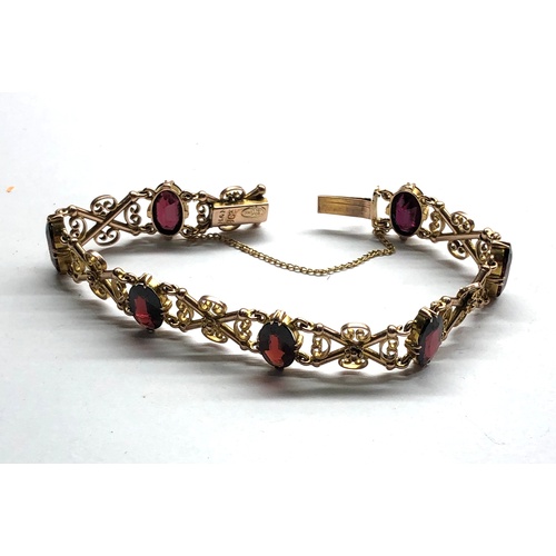 183 - Vintage 9ct gold and garnet bracelet measures approx 19cm by 1.2cm wide fully hallmarked weight 14.6... 