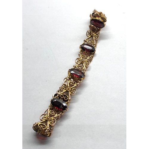 183 - Vintage 9ct gold and garnet bracelet measures approx 19cm by 1.2cm wide fully hallmarked weight 14.6... 