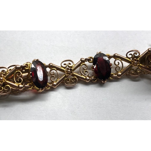 183 - Vintage 9ct gold and garnet bracelet measures approx 19cm by 1.2cm wide fully hallmarked weight 14.6... 