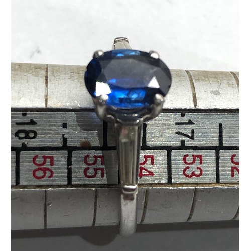 185 - Platinum sapphire ring central sapphire measures approx 9mm by 6.5mm