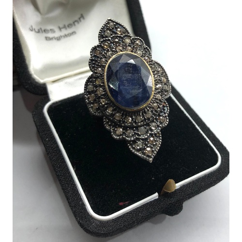 191 - Large silver rose diamond and sapphire dress ring central blue stone measures approx 15mm by12mm wit... 