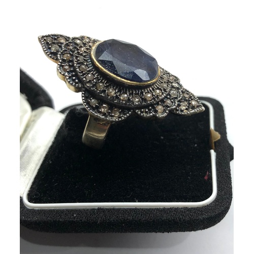 191 - Large silver rose diamond and sapphire dress ring central blue stone measures approx 15mm by12mm wit... 