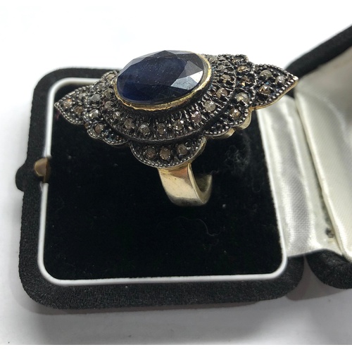 191 - Large silver rose diamond and sapphire dress ring central blue stone measures approx 15mm by12mm wit... 