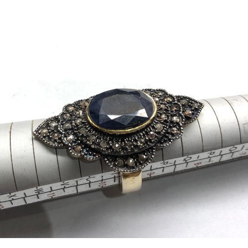 191 - Large silver rose diamond and sapphire dress ring central blue stone measures approx 15mm by12mm wit... 