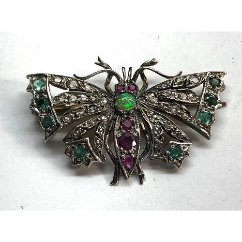 193 - Diamond emerald and ruby set butterfly brooch set in silver and gold backed measures approx 41mm by ... 