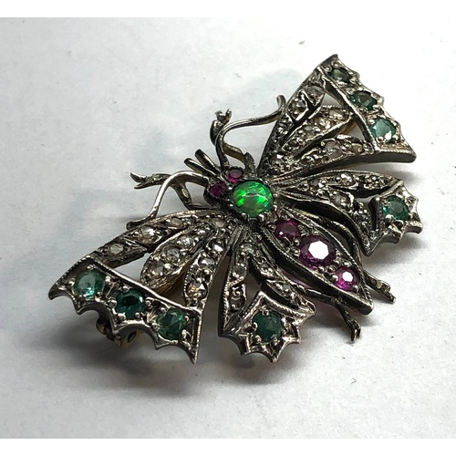 193 - Diamond emerald and ruby set butterfly brooch set in silver and gold backed measures approx 41mm by ... 