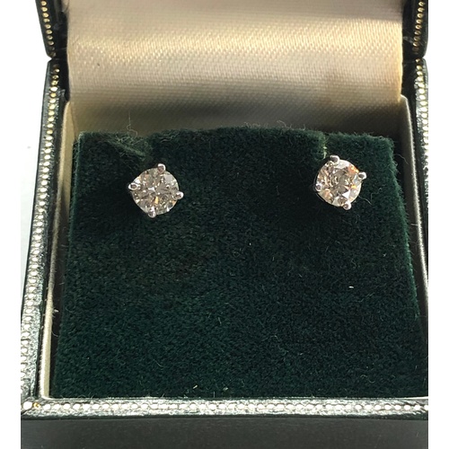 199 - Pair of diamond stud earring each have a diamond that measures approx 5.1mm dia 1.02ct set in 18ct w... 