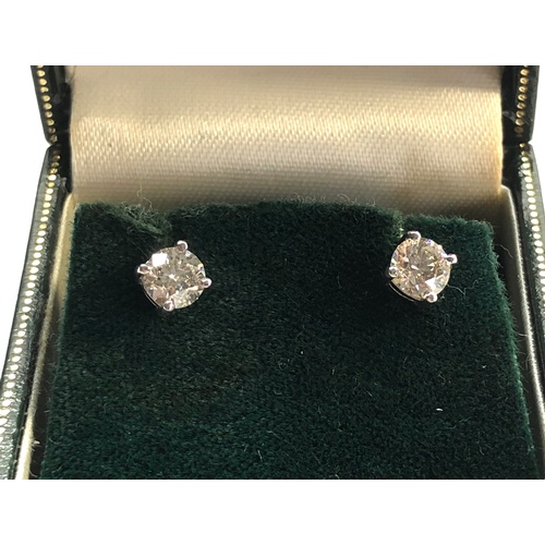 199 - Pair of diamond stud earring each have a diamond that measures approx 5.1mm dia 1.02ct set in 18ct w... 