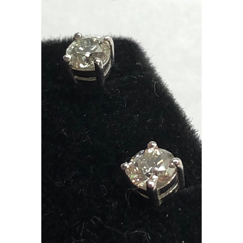 199 - Pair of diamond stud earring each have a diamond that measures approx 5.1mm dia 1.02ct set in 18ct w... 