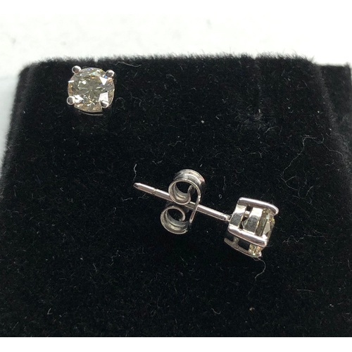 199 - Pair of diamond stud earring each have a diamond that measures approx 5.1mm dia 1.02ct set in 18ct w... 