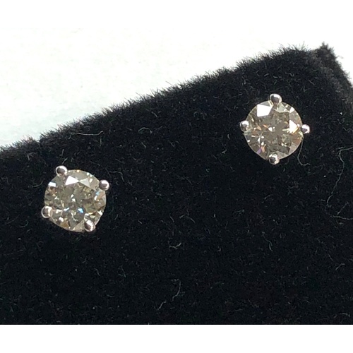 199 - Pair of diamond stud earring each have a diamond that measures approx 5.1mm dia 1.02ct set in 18ct w... 