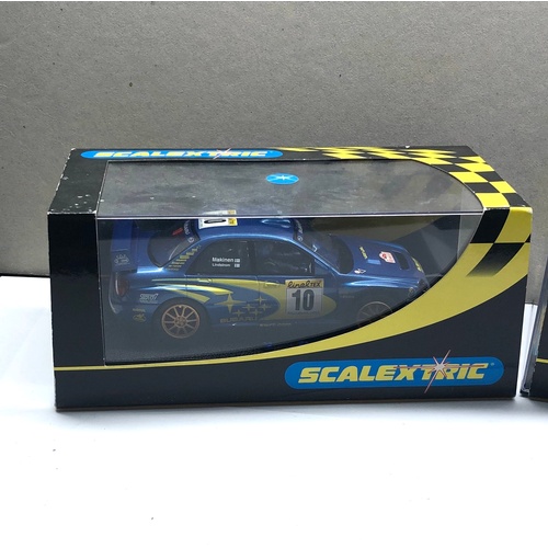 397 - 2 Boxed scalextric car c2362 Mitsubishi Lancer and Subaru Impreza c2412