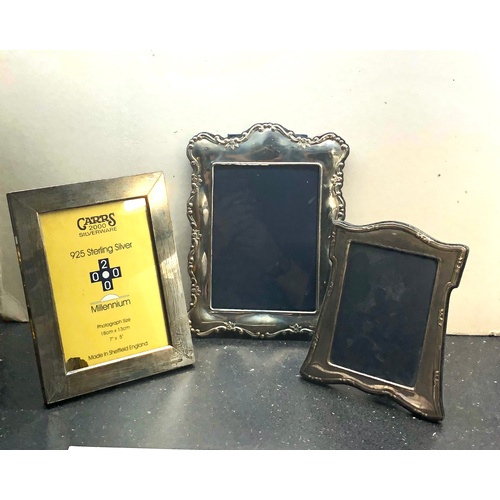 64 - 3 Silver picture frames largest measures approx 26.5cm by 19.5cm