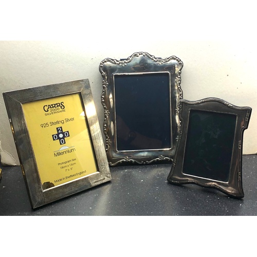 64 - 3 Silver picture frames largest measures approx 26.5cm by 19.5cm