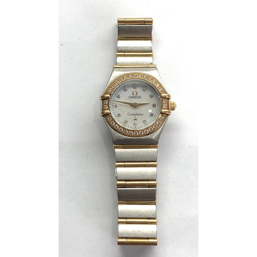 306 - Ladies diamond dial and bezel gold and stainless bi-metal Omega constellation watch is in working or... 