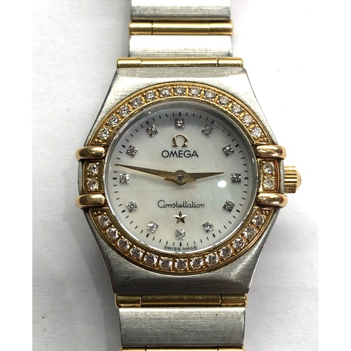 306 - Ladies diamond dial and bezel gold and stainless bi-metal Omega constellation watch is in working or... 