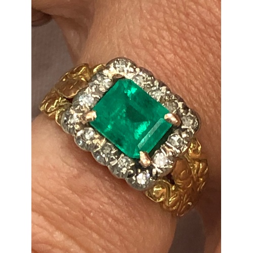 113 - 18ct gold diamond and emerald ring set with large central emerald that measures approx 7mm by 6.5mm ... 