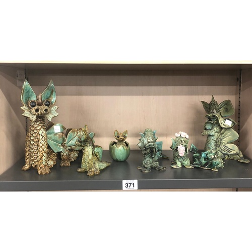 371 - Shelf of Yare designs pottery dragons