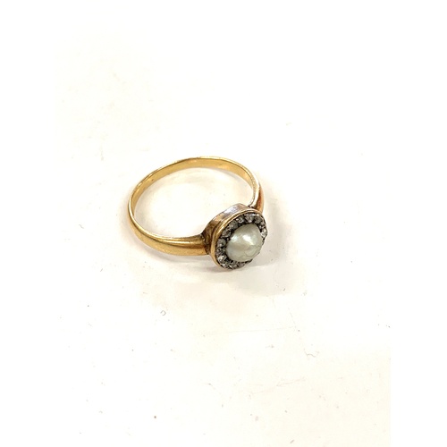 166 - 18ct gold, hallmarked pearl and diamond ring, ring size between S/T, approximate weight 4g.