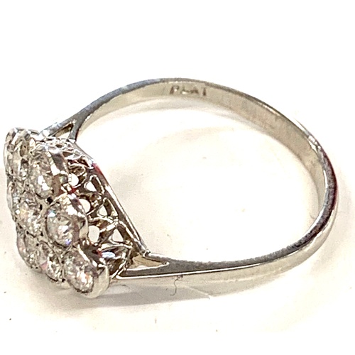 167 - Platinum and diamond ladies cluster ring, ring size M/N, approximate weight 3.4g, Inside of ring rea... 