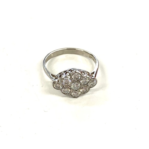 167 - Platinum and diamond ladies cluster ring, ring size M/N, approximate weight 3.4g, Inside of ring rea... 