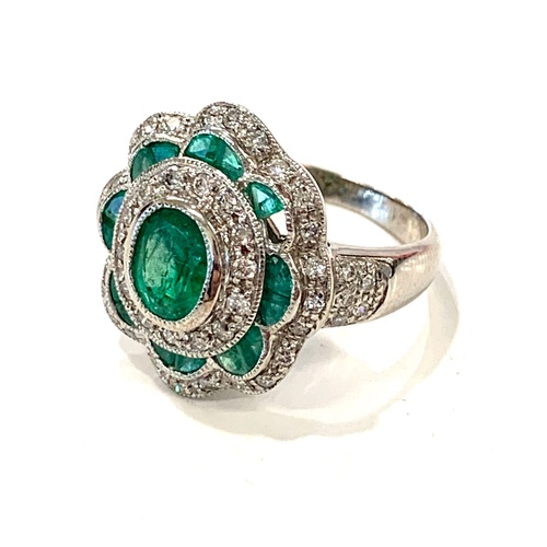 170 - 18ct Diamond and Emerald cluster ring, approximate weight 7.9g, ring size between P/Q. The ring has ... 