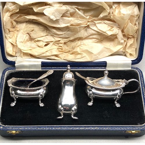 125 - boxed silver cruet set blue glass liners Birmingham silver hallmarks