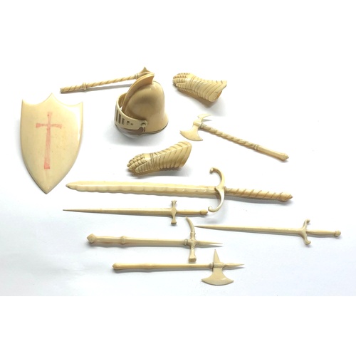 401 - 19th / 20th century Miniature carved ivory or bone knights helmet gloves sheild and weapons