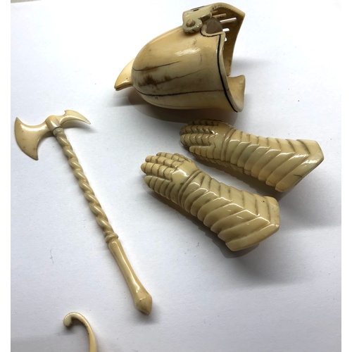 401 - 19th / 20th century Miniature carved ivory or bone knights helmet gloves sheild and weapons