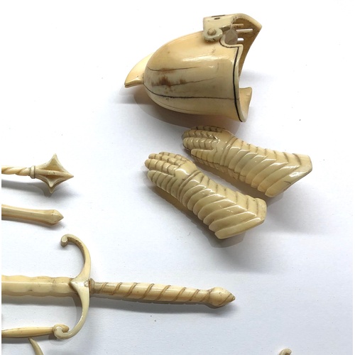 401 - 19th / 20th century Miniature carved ivory or bone knights helmet gloves sheild and weapons