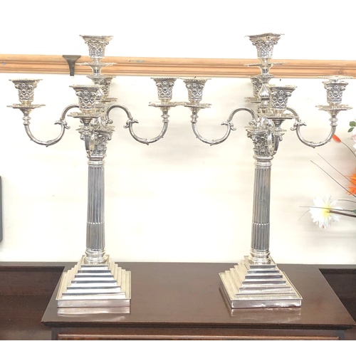 132 - large pair of silver candleabra measures appox 22ins tall by 14ins wide total weight approx 7.8 kilo... 