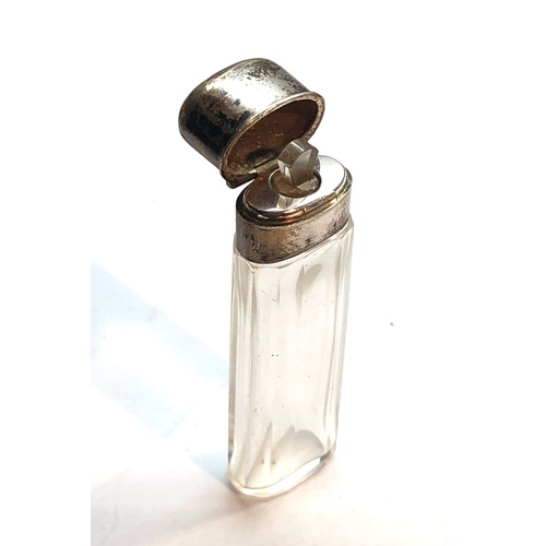 142 - antique silver top perfume bottle measures approx 7cm tall with original glass stopper in good uncle... 
