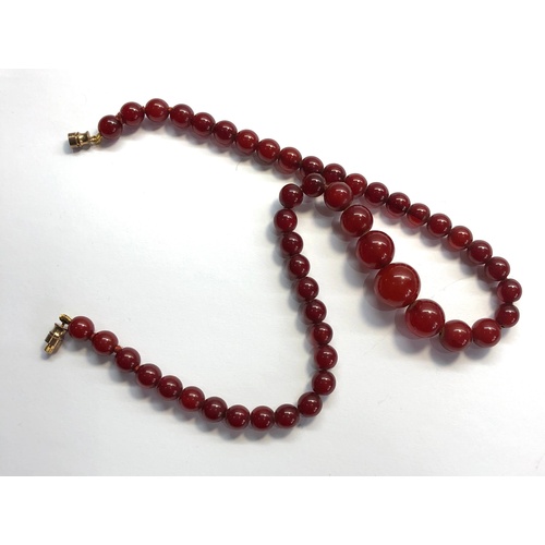 157 - Antique round cherry amber / bakelite bead necklace graduated round beads largest measures approx 14... 