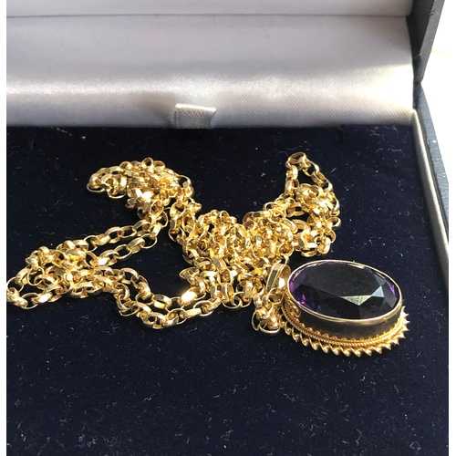 154 - 9ct Gold and Amethyst set pendant with gold chain Amethyst stone measures approx 17mm by 12mm set on... 