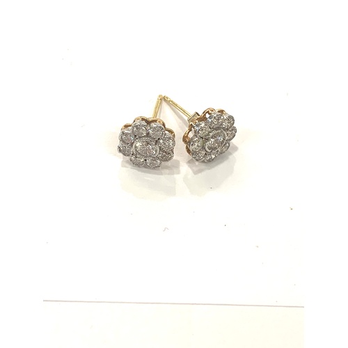 172 - Pair gold diamond cluster ladies earrings, centre diamond measures approximately 4mm, total overall ... 