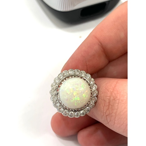 176 - Large opal and diamond platinum ladies ring,  opal measures approximately 13mm in diameter, total wi... 